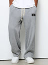 Pantaloni uomo ampi con vita elasticizzata e coulisse