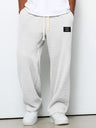 Pantaloni uomo ampi con vita elasticizzata e coulisse