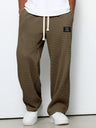 Pantaloni uomo ampi con vita elasticizzata e coulisse
