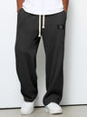 Pantaloni uomo ampi con vita elasticizzata e coulisse