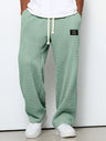 Pantaloni uomo ampi con vita elasticizzata e coulisse