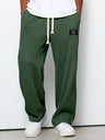 Pantaloni uomo ampi con vita elasticizzata e coulisse