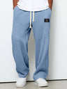 Pantaloni uomo ampi con vita elasticizzata e coulisse