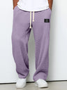 Pantaloni uomo ampi con vita elasticizzata e coulisse